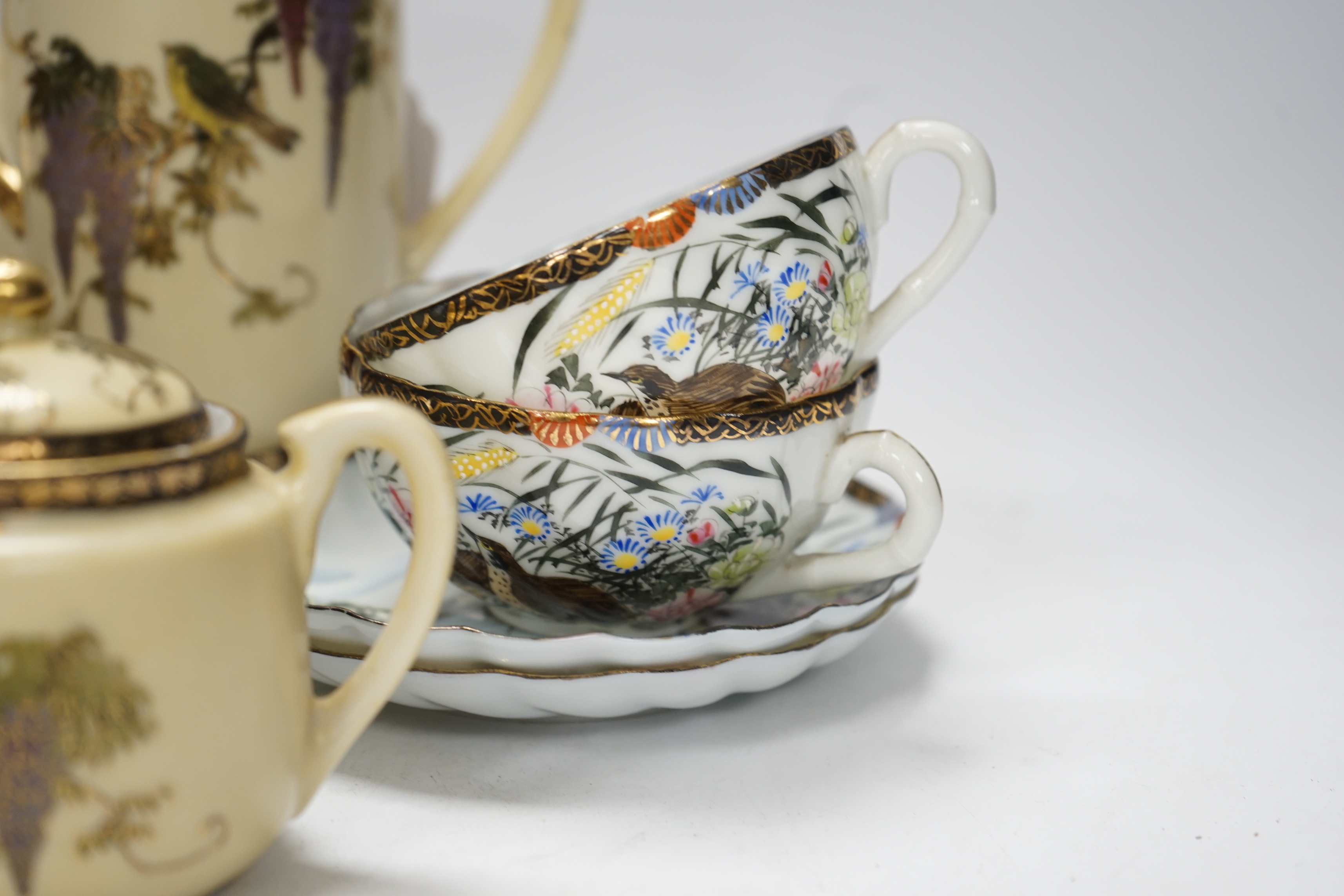 A Japanese cloisonné enamel vase, a pair of enamelled buttons and assorted Japanese ceramics including satsuma and kutani